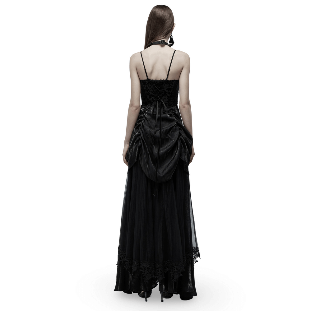 Back view of elegant tulle and velvet gothic gown showcasing dramatic drawstring bustle and intricate detailing.