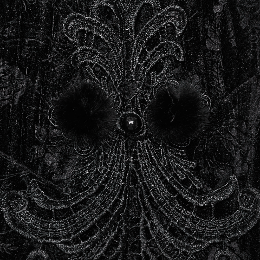 Close-up of intricate velvet appliques and fur buttons on a gothic dress, showcasing elegant black details.