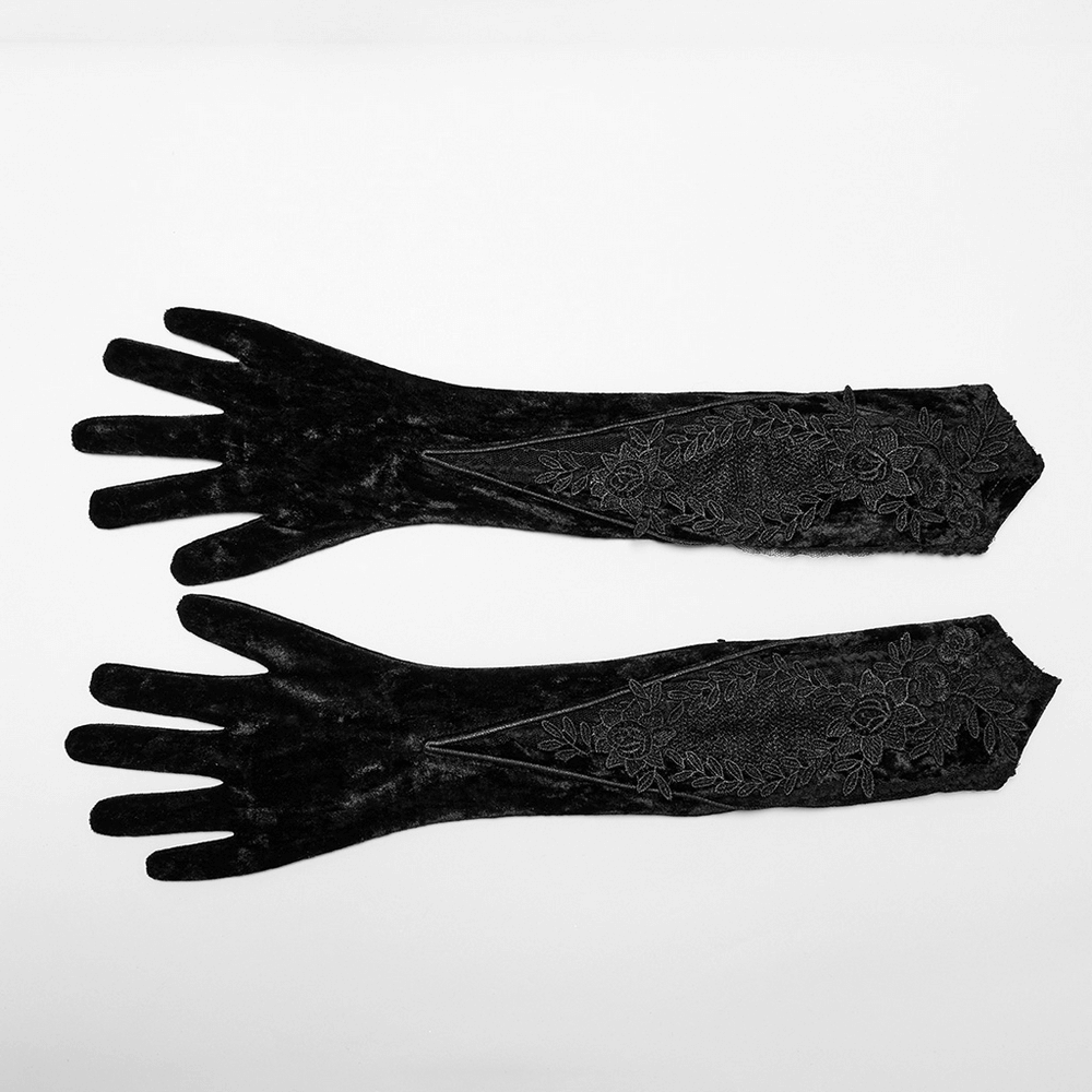 Elegant black velvet embroidered arm gloves showcasing intricate floral designs and pointed cuffs for a Gothic look.