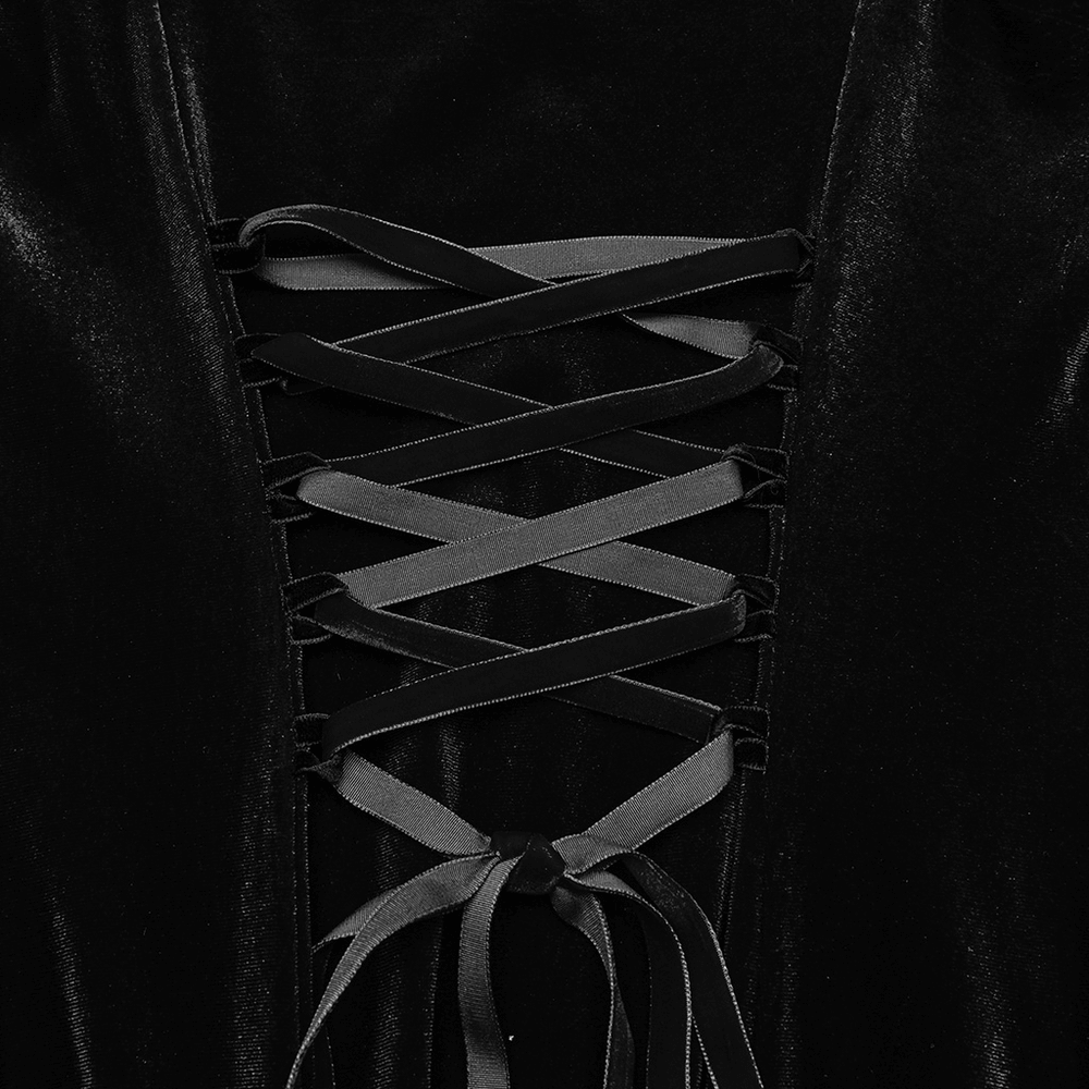 Close-up of black velvet dress lace-up detailing, showcasing elegant design and gothic style.