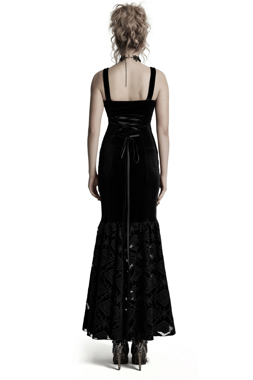 Back view of a vintage gothic velvet embroidered dress with pleated hem and drawstring detail.