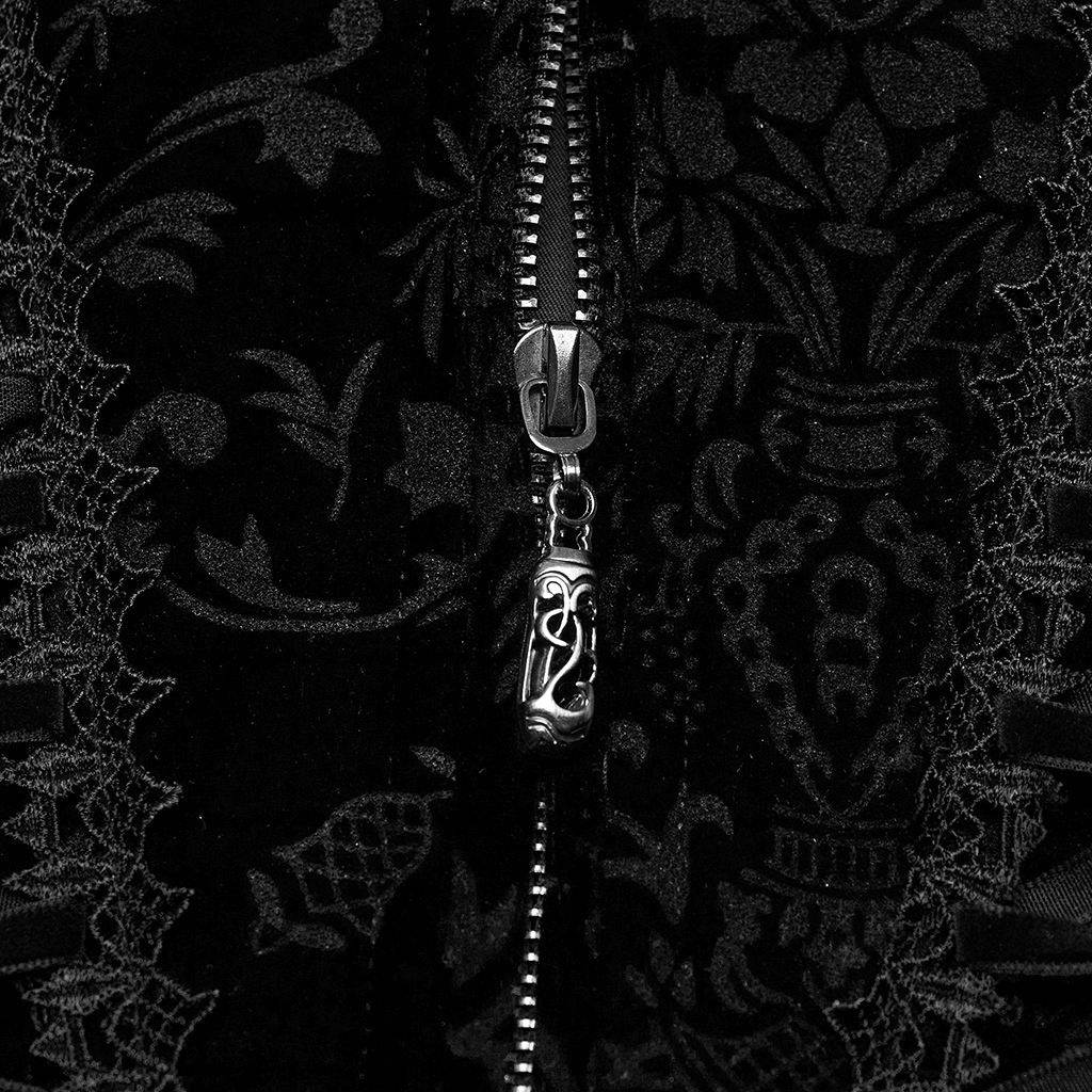 Close-up of an elegant black velvet goth corset zipper with intricate lace details.