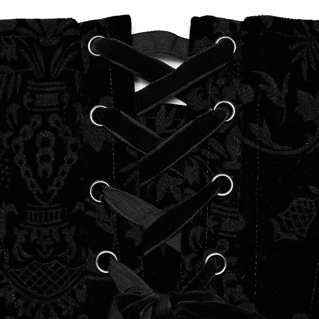Close-up of an elegant black velvet corset showcasing intricate lace-up details and gothic patterns.