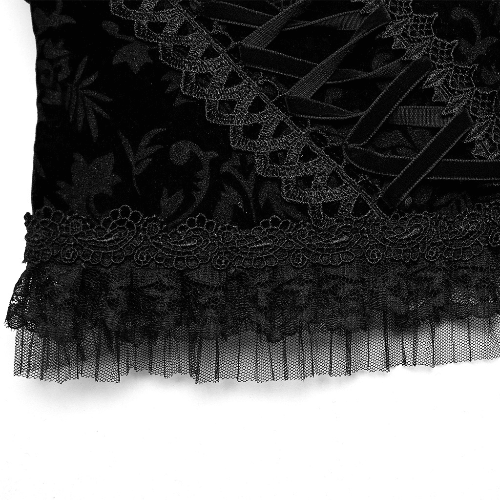 Close-up of an elegant black velvet corset with intricate lace detailing and ruffled hem for gothic style.