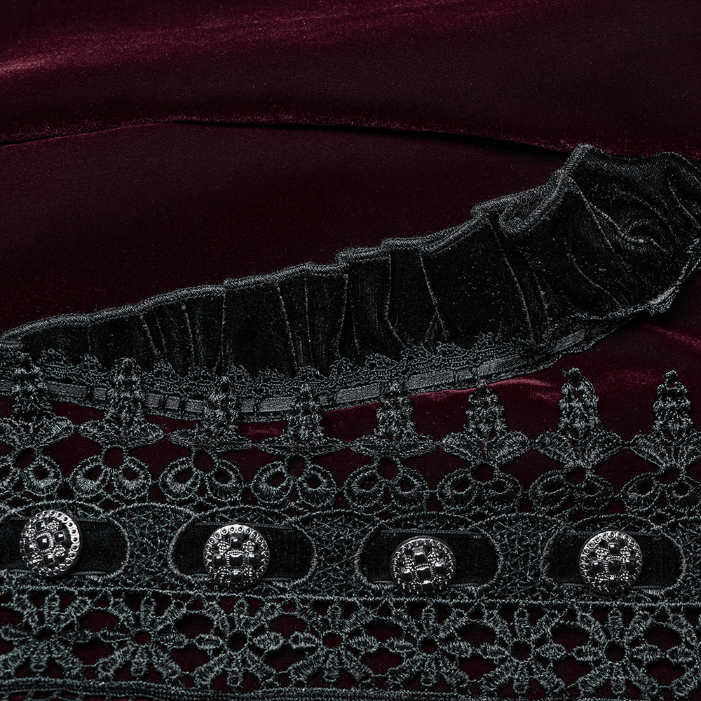 Elegant velvet fabric with intricate lace and ruffle details, featuring exquisite button accents.