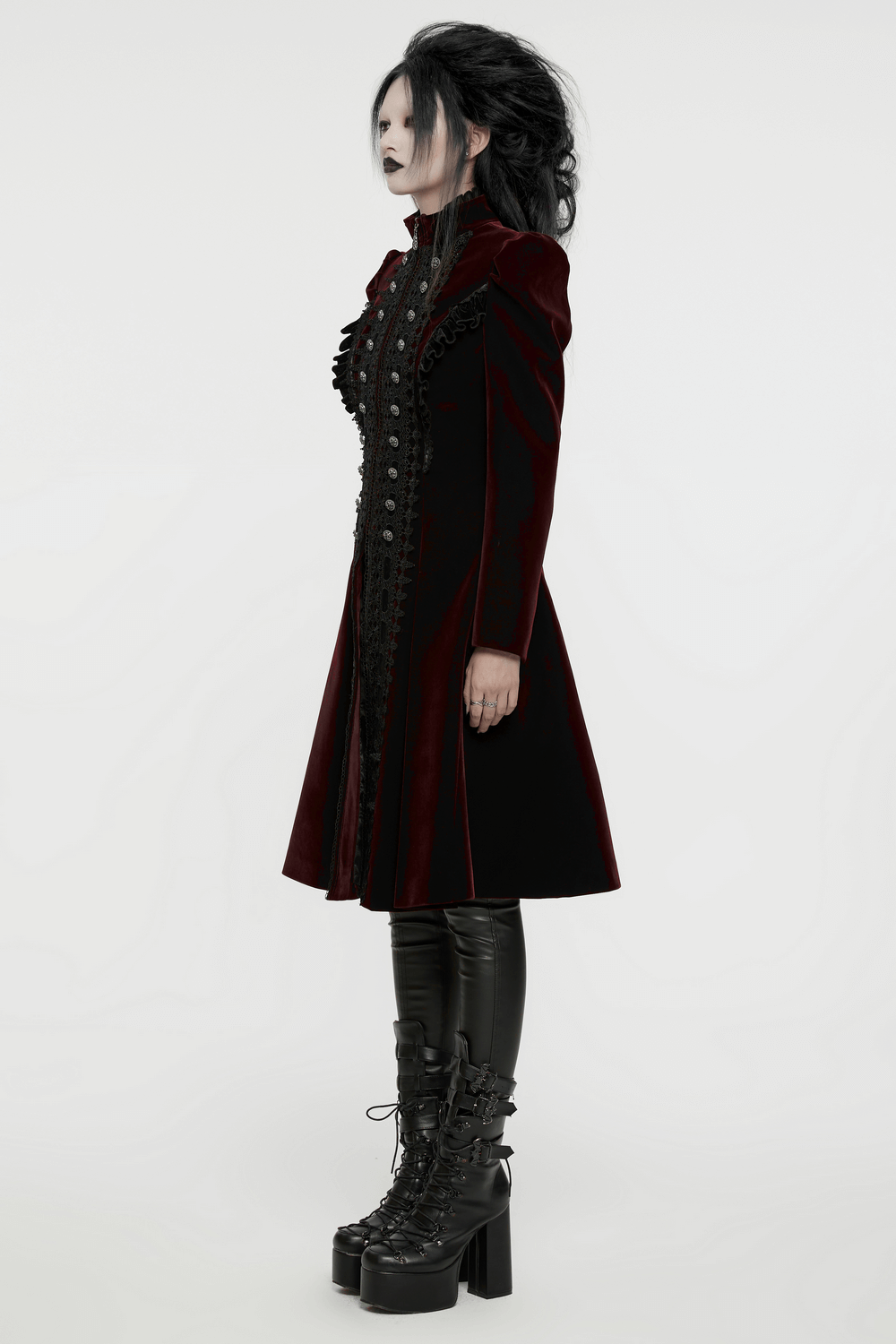 Elegant velvet Gothic coat with lace and ruffle details, featuring exquisite button accents and dramatic A-line silhouette.