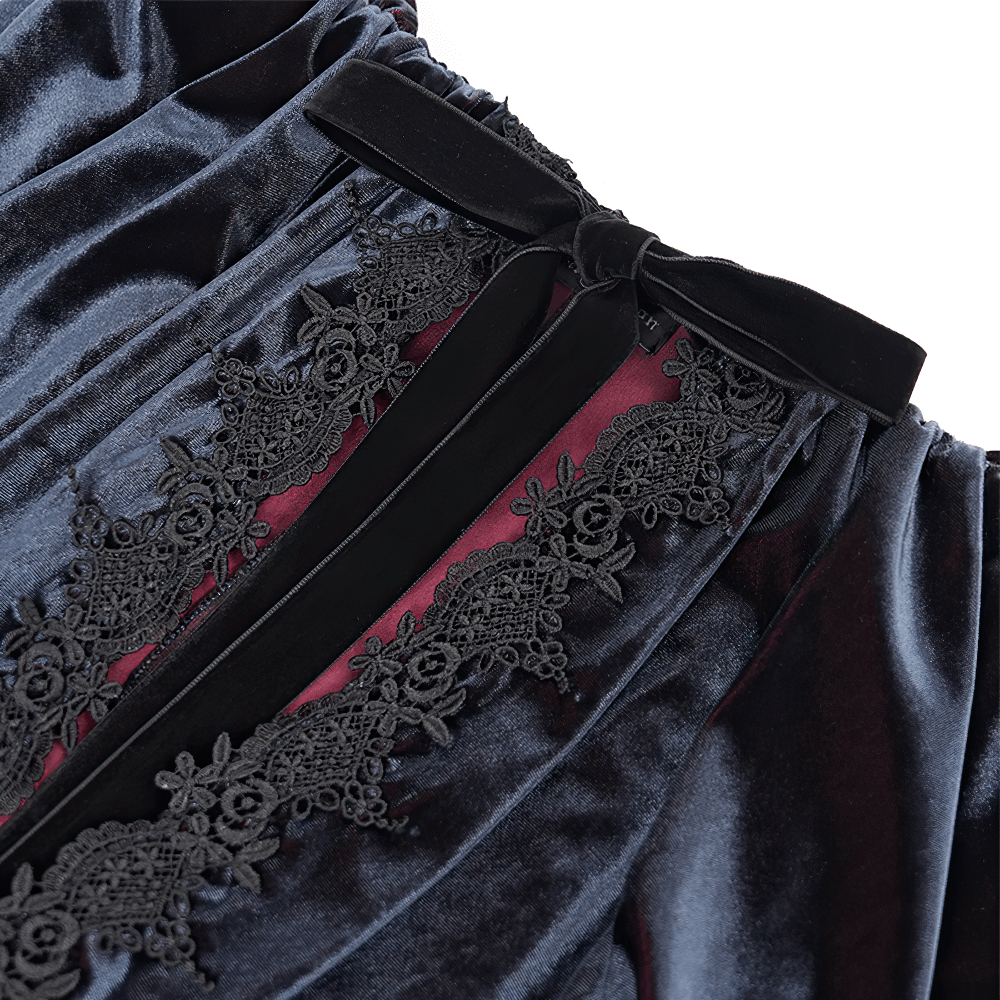 Elegant velvet cape with intricate lace detailing and bow, showcasing gothic fashion sophistication.