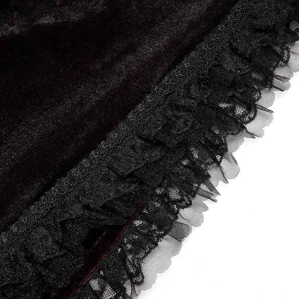 Close-up of black velvet cloak edge with delicate lace trim, showcasing gothic elegance and intricate details.