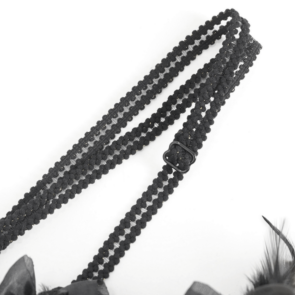 Close-up of a black braided strap with adjustable buckle for elegant Victorian dress fashion.