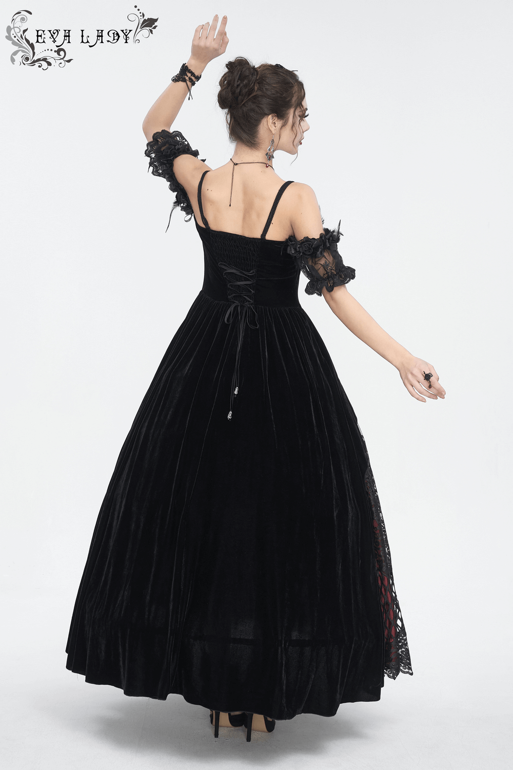 Elegant black velvet off-the-shoulder Victorian dress with dramatic skirt and red lace accents, perfect for gothic occasions.