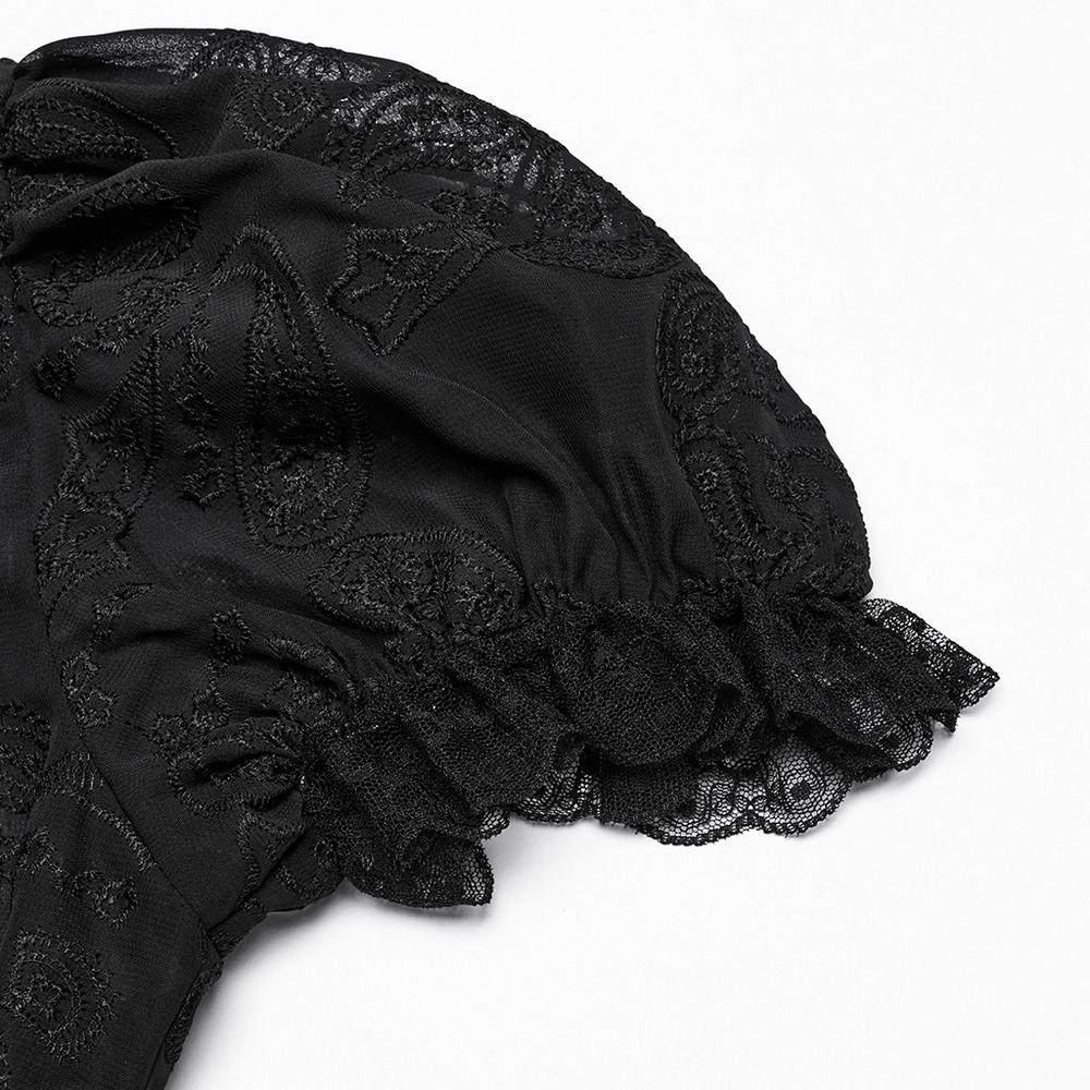 Elegant Victorian black lace puff sleeve detail on chiffon blouse, perfect for Gothic fashion enthusiasts.