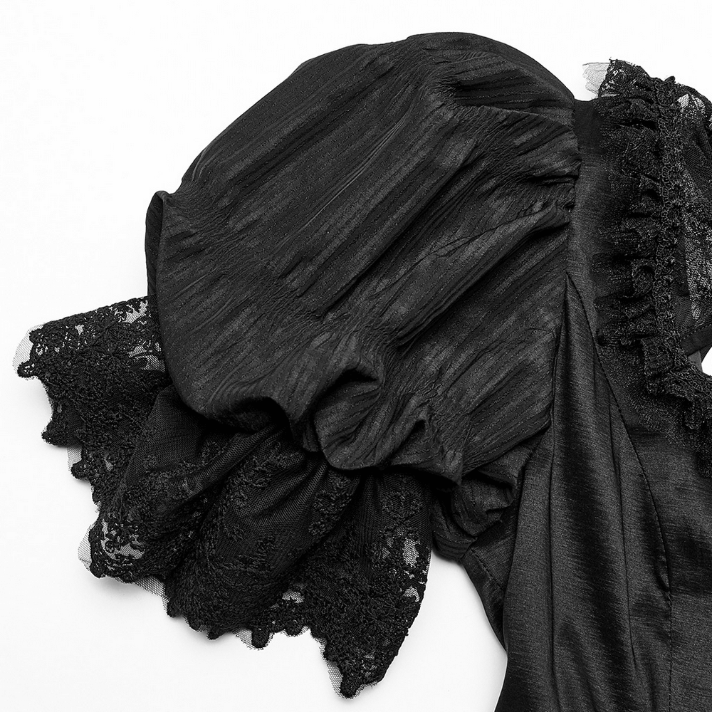 Close-up of elegant black lace ruffled sleeve detail on a Victorian Gothic evening gown.