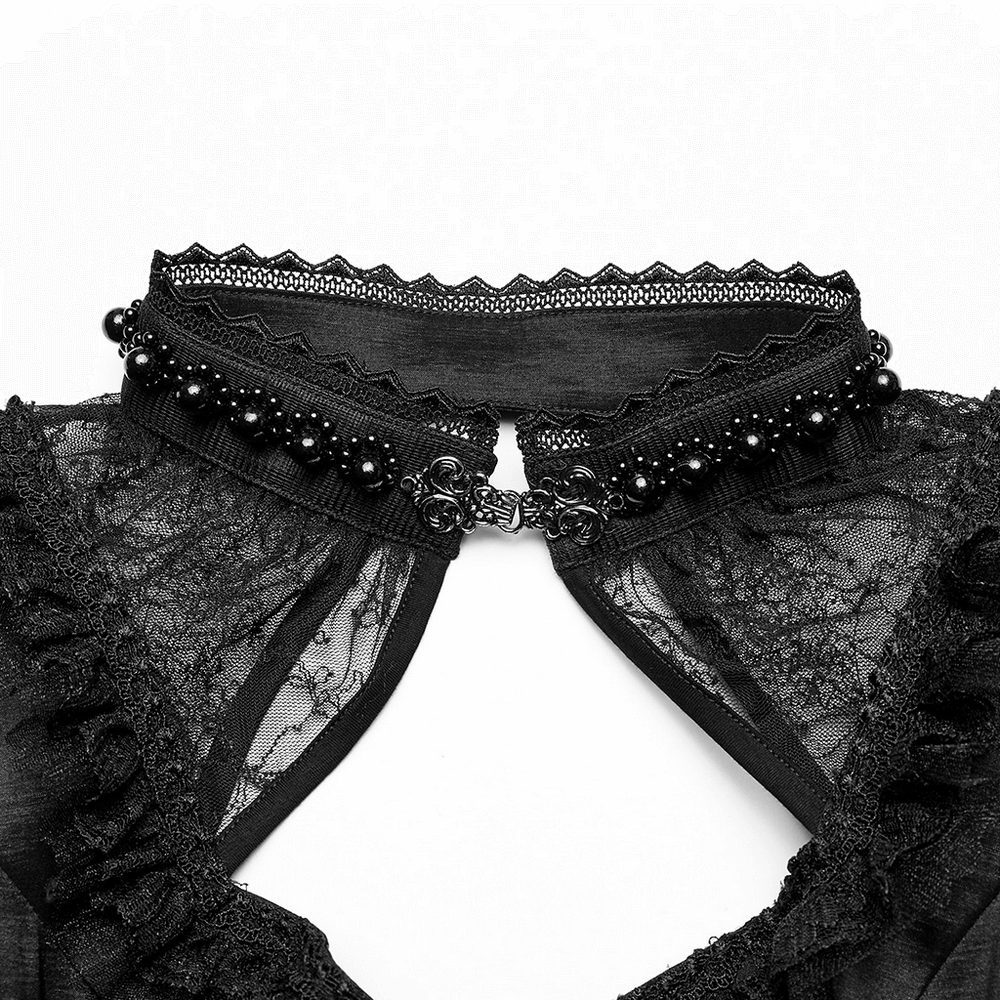 Close-up of a gothic lace collar with pearl embellishments and intricate ruffles, perfect for a Victorian-inspired evening gown.