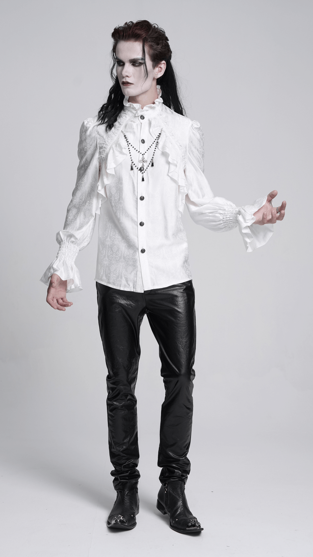 Elegant Victorian Gothic man wearing a ruffled long sleeve white shirt and black pants, perfect for steampunk or cosplay.