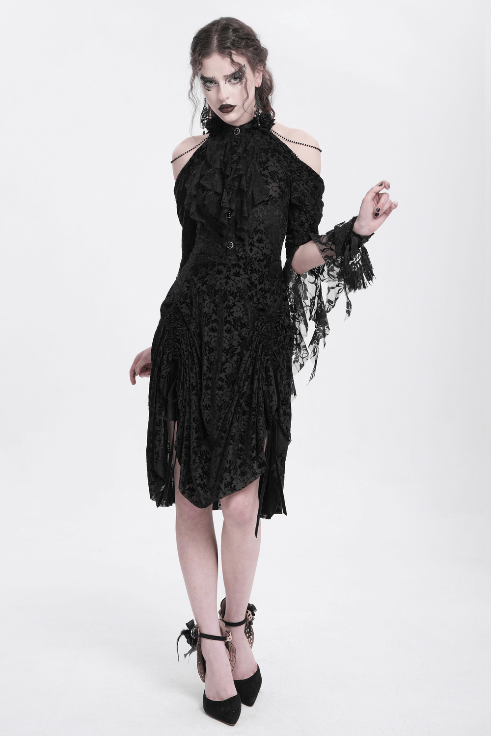 Model wearing an elegant Victorian lace Gothic dress with ruffle details, exuding a dark, romantic aesthetic.