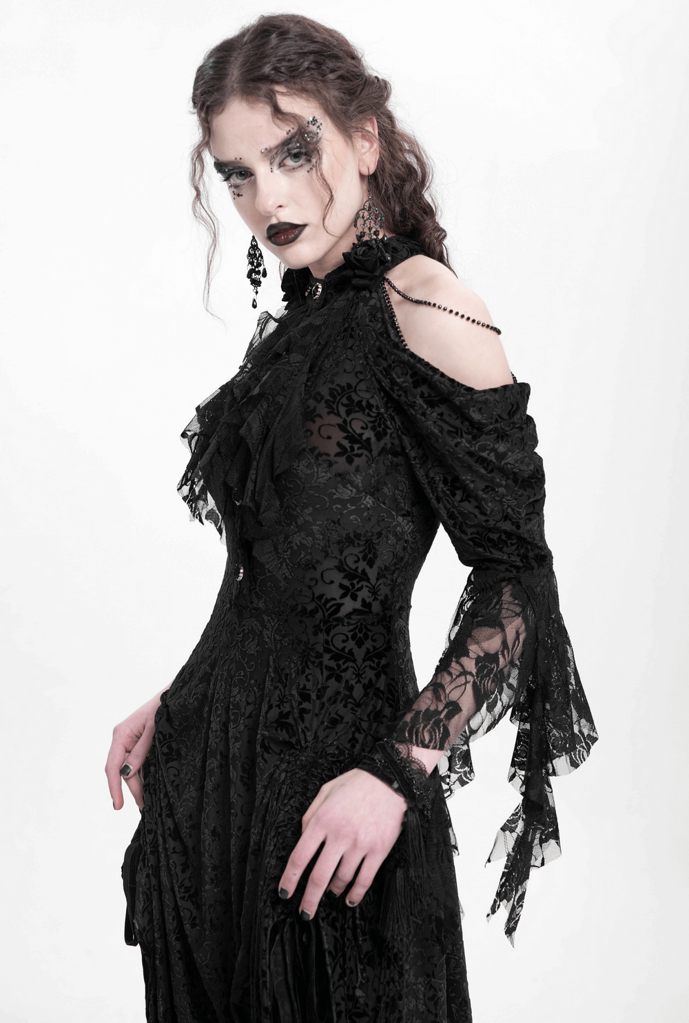 Elegant Gothic Victorian lace dress with ruffle details, showcasing dark romantic aesthetics and intricate lace sleeves.