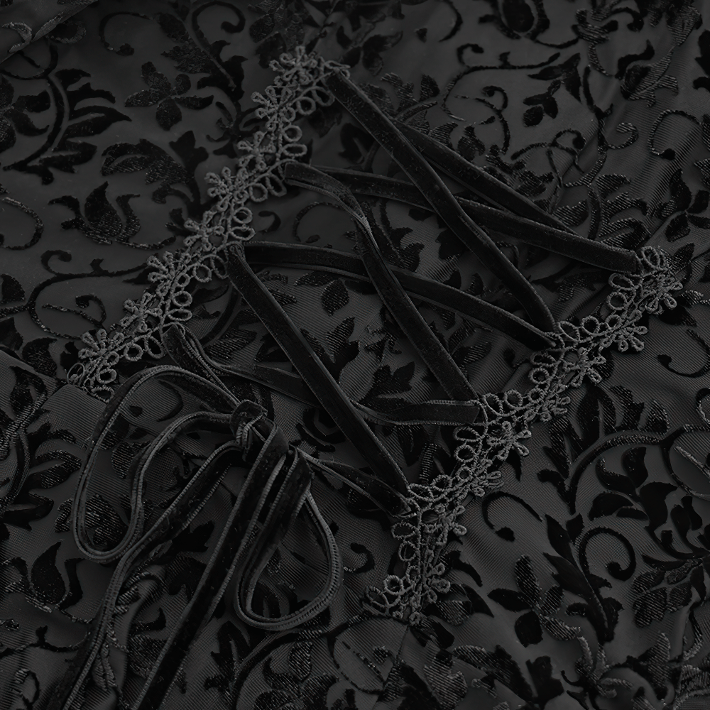 Close-up of elegant Victorian lace detailing on a Gothic dress with ruffle and ribbon accents.