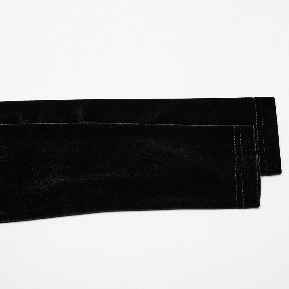 Elegant black velvet fabric showcasing the detailed seams of stylish pants for a chic and modern look.