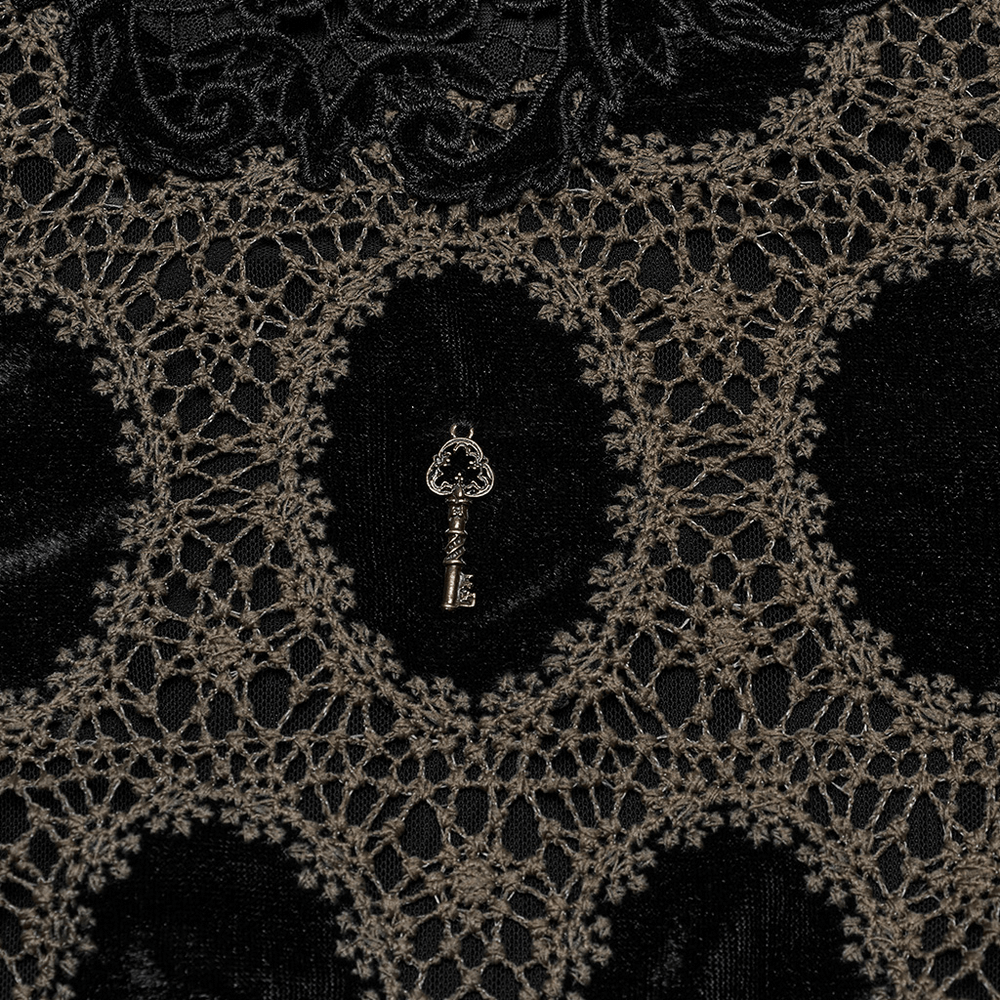 Close-up of elegant Victorian lace and velvet fabric featuring intricate key design embellishments.
