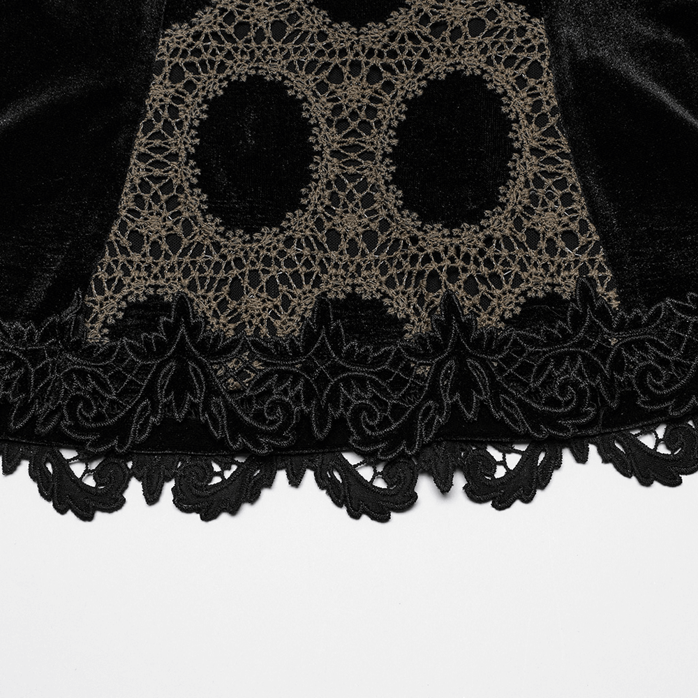 Close-up of elegant Victorian lace detailing on a velvet top with intricate black lace trim.