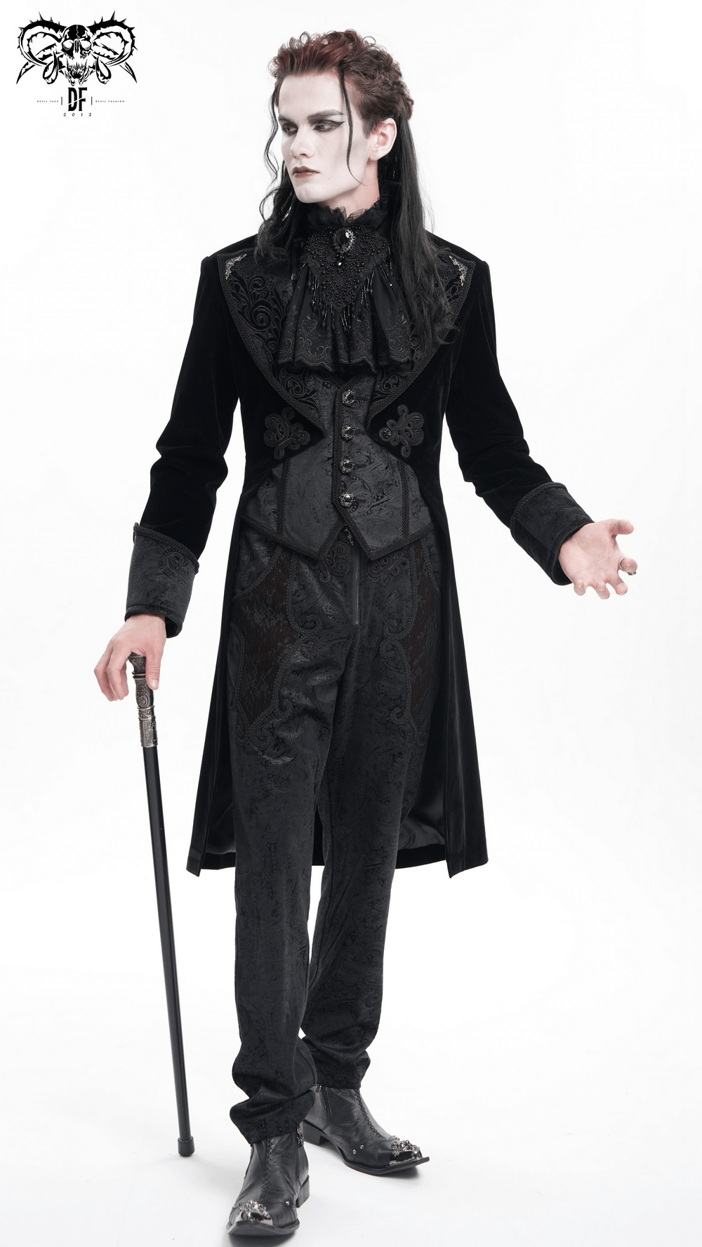 Elegant Victorian tailcoat model showcasing intricate brocade details and embroidered lapels in luxurious velvet fabric.