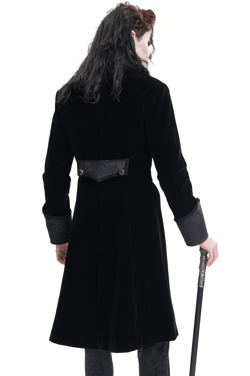Back view of an elegant black velvet Victorian tailcoat with brocade details and a cane. Perfect for gothic-themed events.