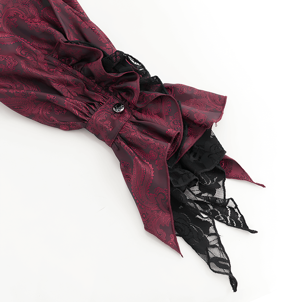Close-up of a wine red Victorian shirt sleeve with decorative lace detailing and elegant frills.
