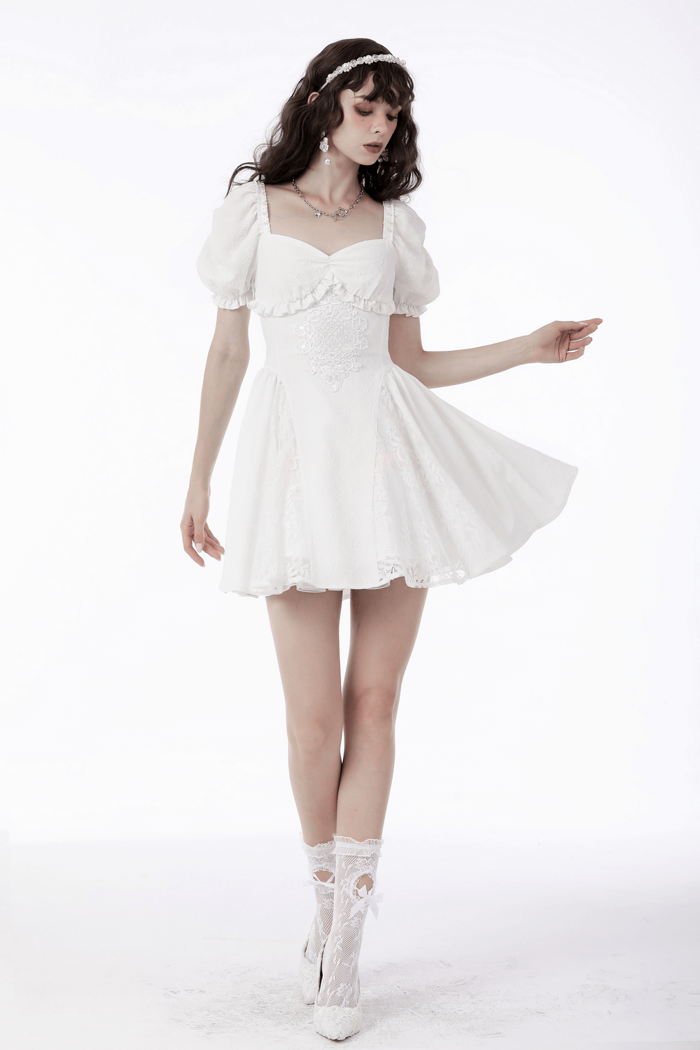Elegant white dress with lace detail, puff sleeves, and floral embroidery, perfect for bridal and special occasions.