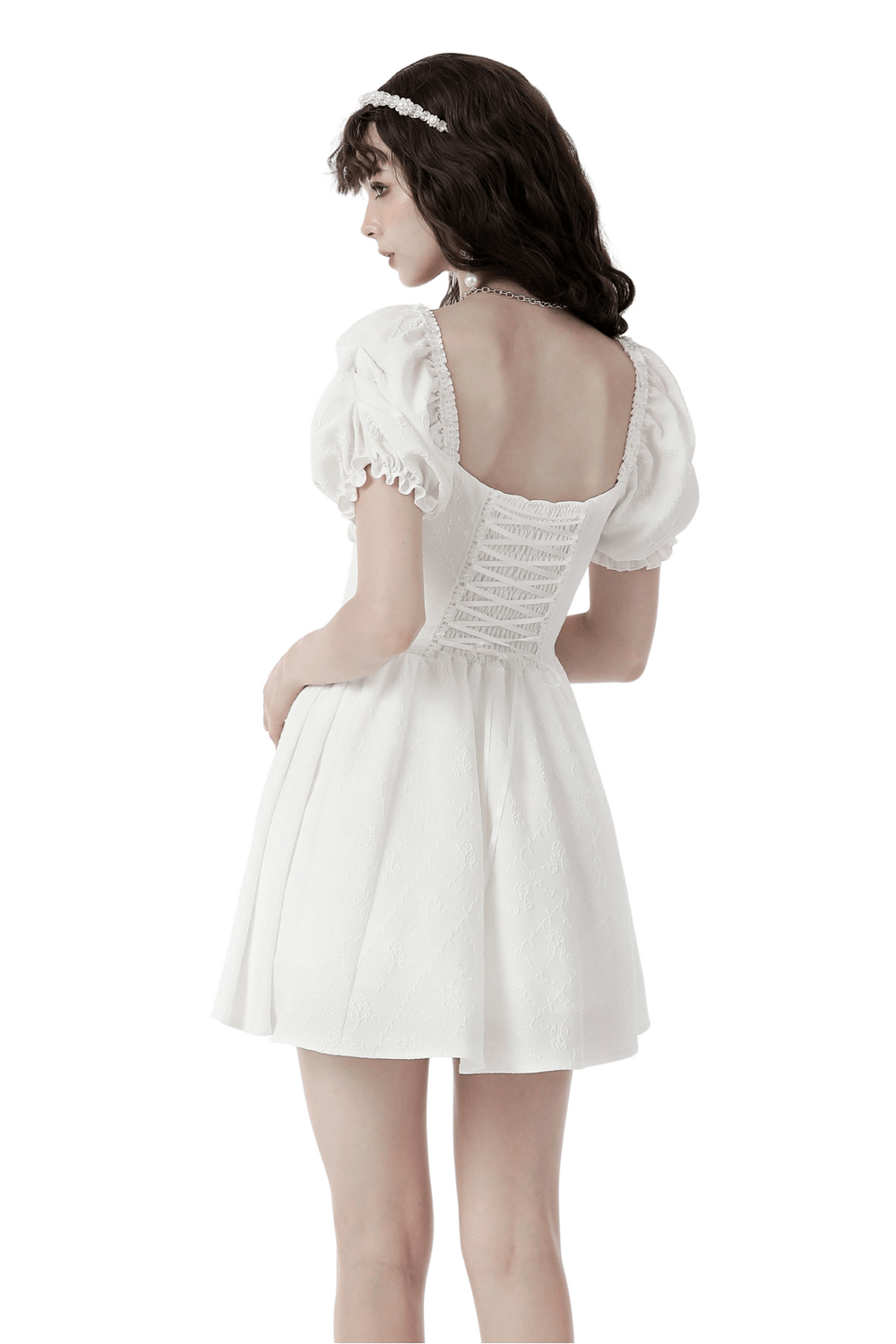 Back view of an elegant white dress with puff sleeves and lace detailing, perfect for weddings and special occasions.