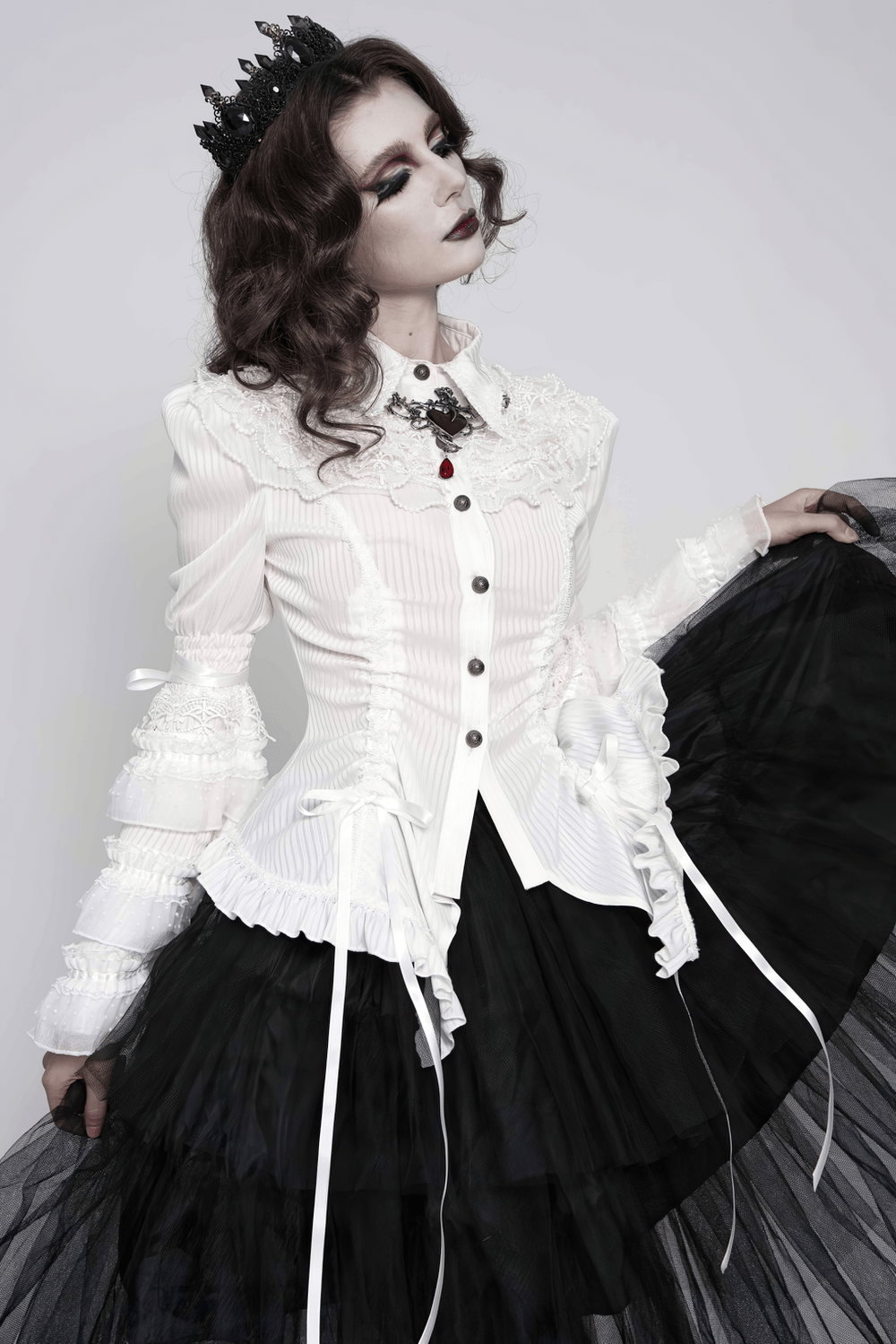 Elegant White Gothic Victorian Ruffle Sleeve Blouse worn with a black tulle skirt, showcasing its ornate design and lace details.