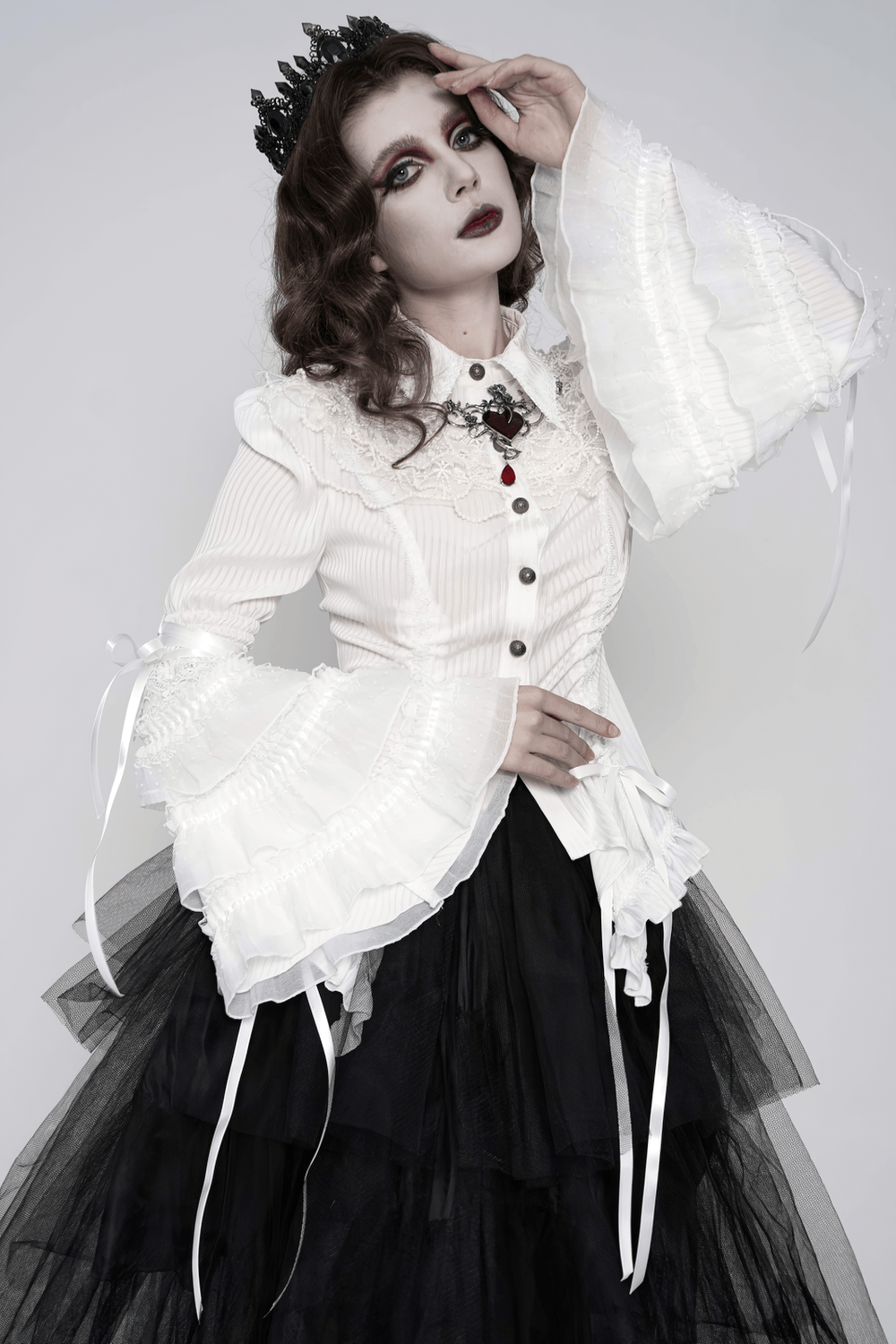 Elegant White Gothic Victorian Ruffle Sleeve Blouse styled with tiered tulle skirt and crown, showcasing dramatic bell sleeves.