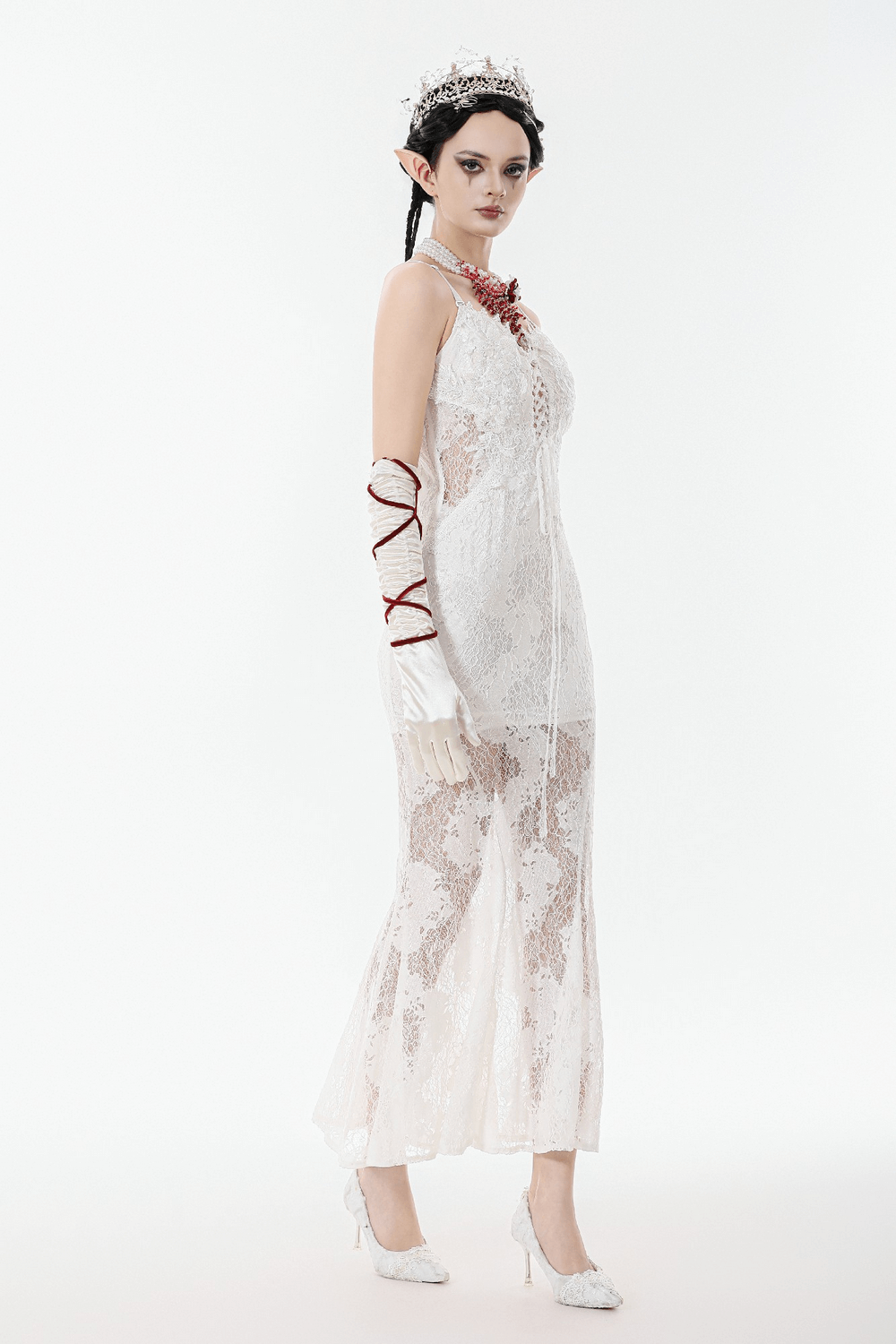 Elegant White Lace Gothic Dress with Spaghetti Straps modeled by a graceful figure, showcasing lace detailing and a fitted silhouette.