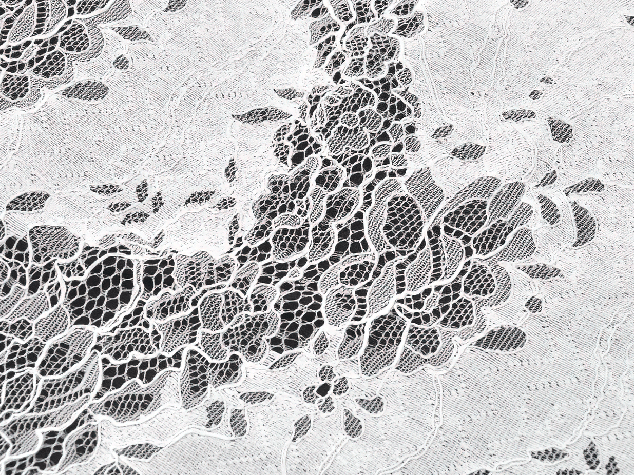 Elegant White Lace Gothic Dress with Spaghetti Straps intricate lace detail on fabric.