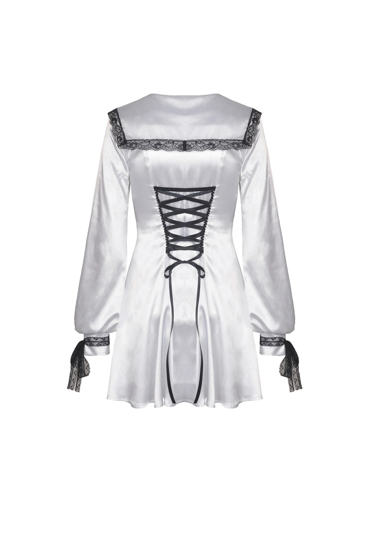 Back view of an elegant white satin dress with black lace detailing and a corset-style tie.