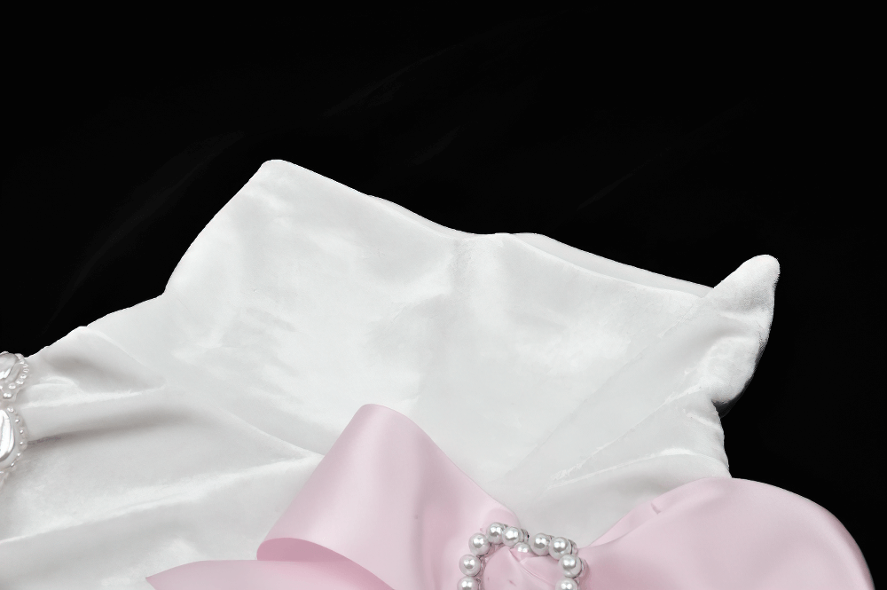 Elegant White Turtleneck Top with Pink Bow Accents