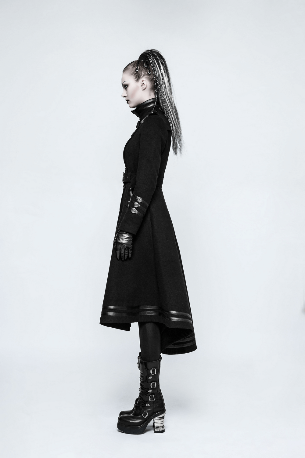 Elegant women in a gothic black long coat with a removable belt, showcasing punk style and unique design.