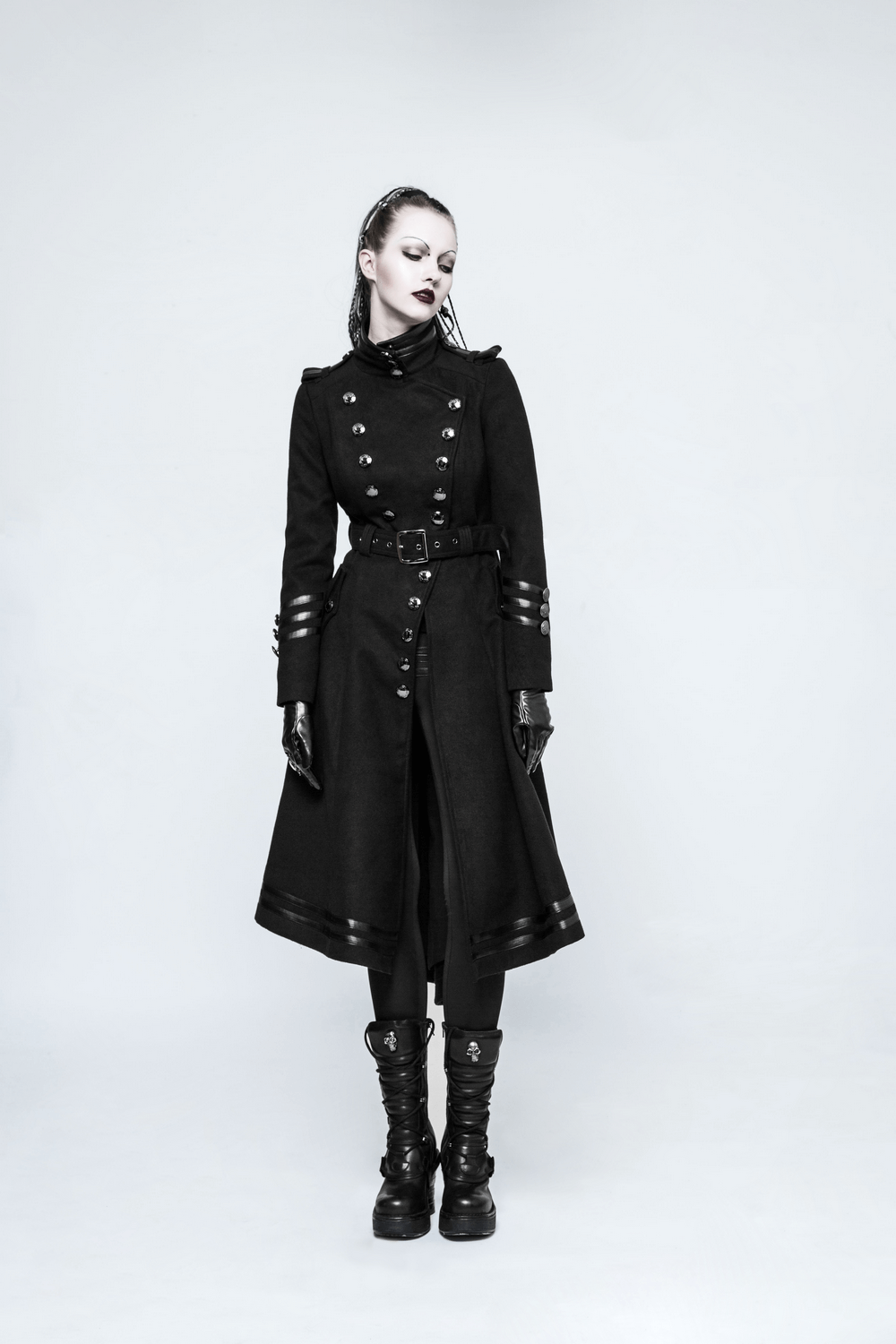 Elegant black Gothic coat with ribbon detail, buttons, and pockets, styled for a punk rave look.