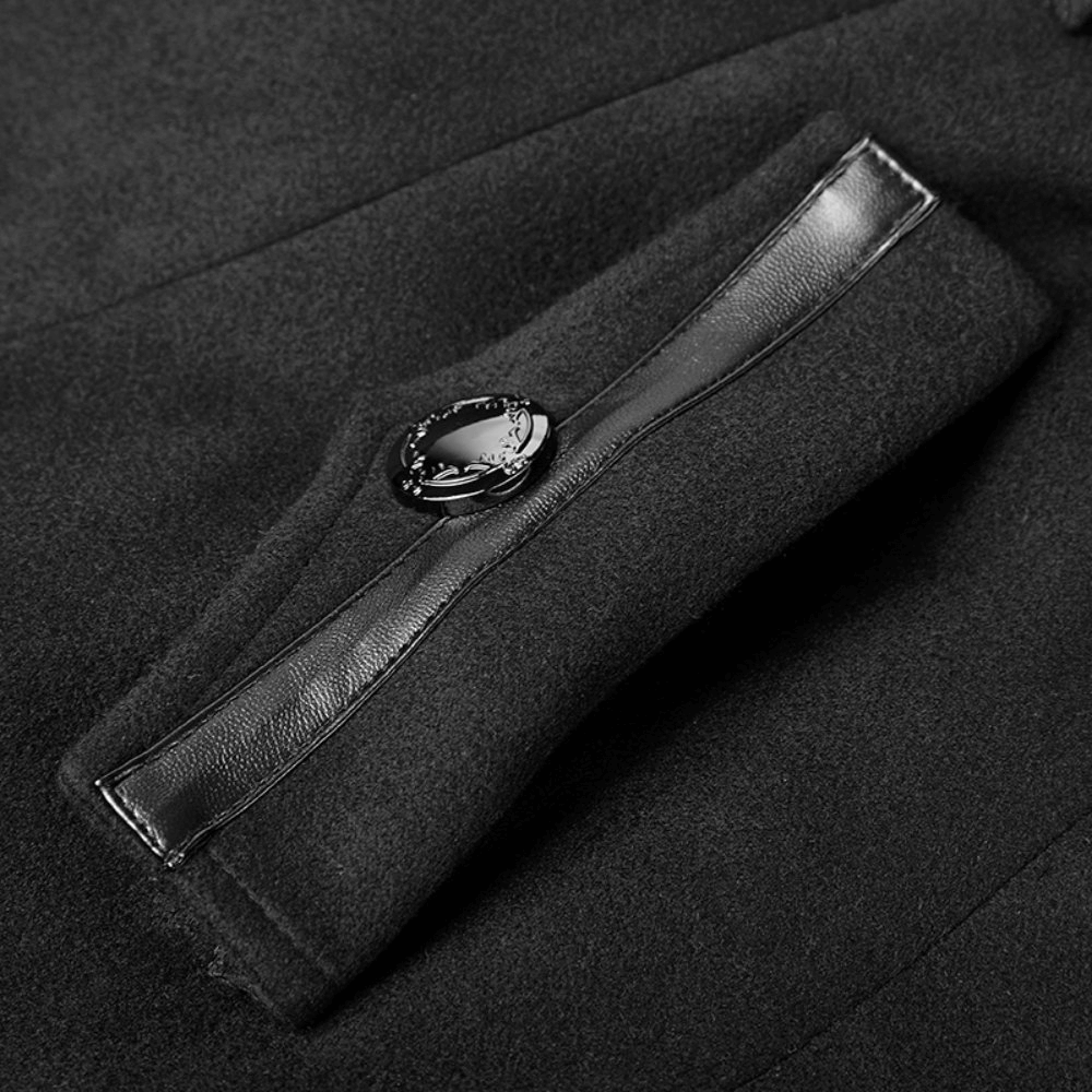Close-up of the elegant black coat pocket featuring a stylish metal button and sleek ribbon detail.