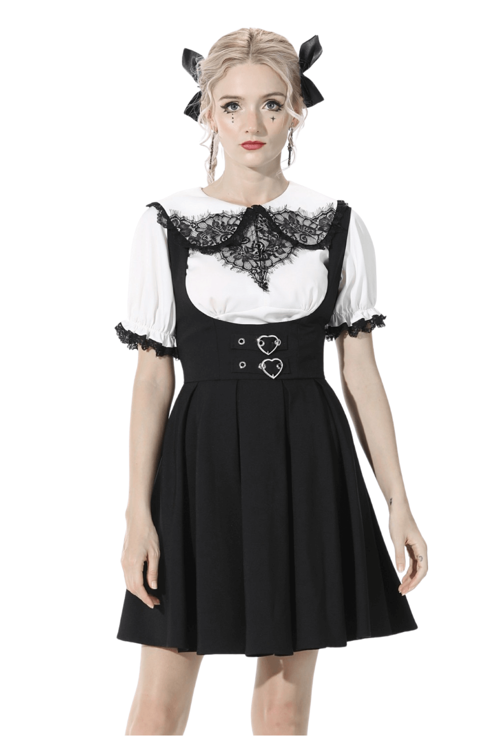 Elegant black dress with heart-shaped buttons and lace detail, perfect for chic evening occasions.