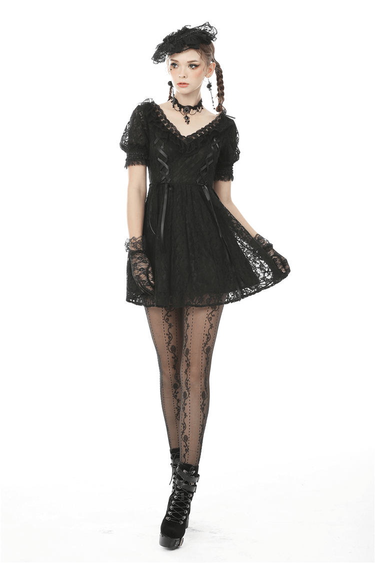 Elegant black lace mini dress with puff sleeves and ribbon detail, styled for gothic chic fashion.