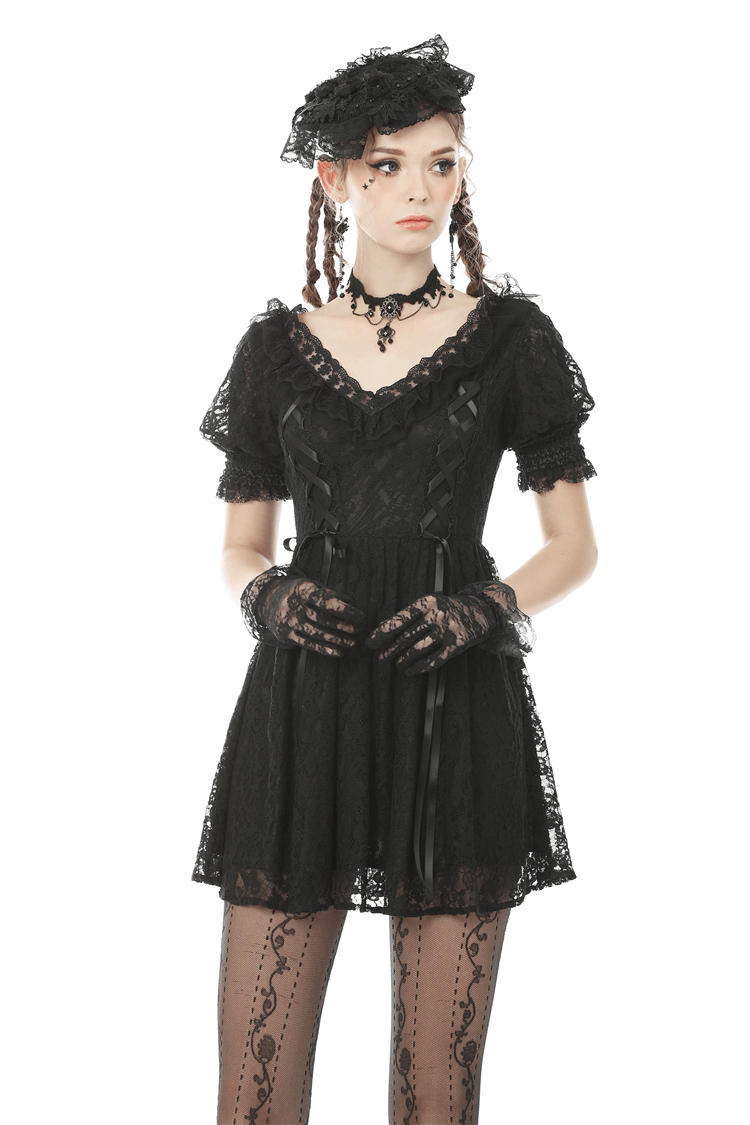 Elegant black lace mini dress with puff sleeves and ribbon detail, perfect for gothic style fashion.