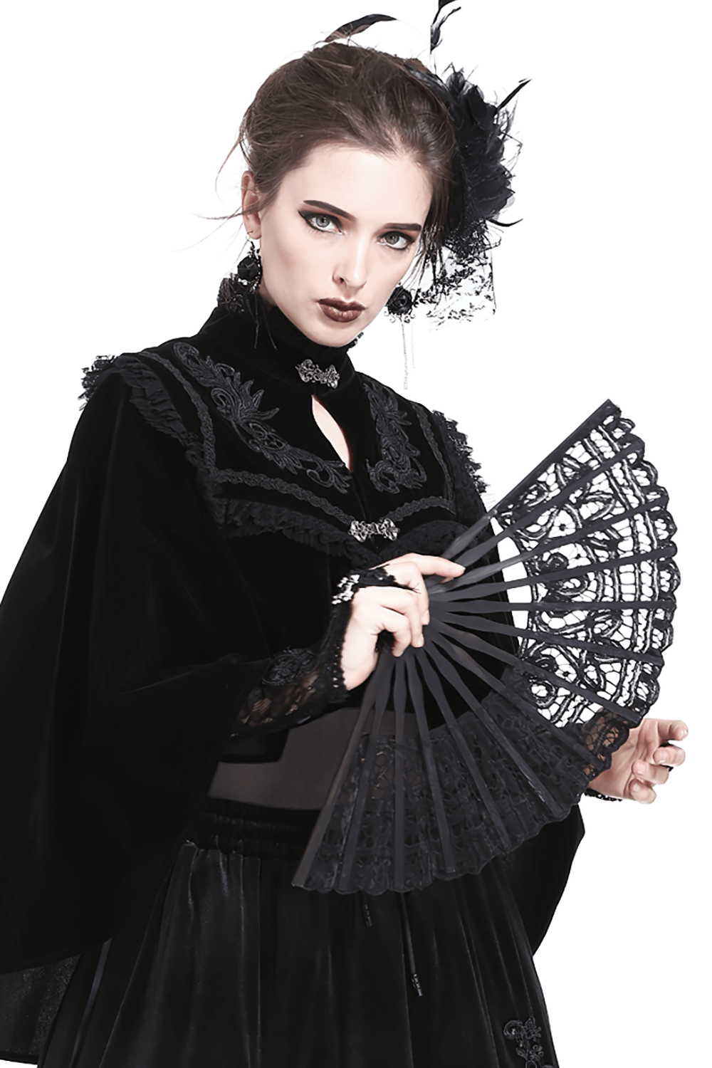 Elegant woman in black lace fan and gothic attire, perfect accessory for evening events and stylish gatherings.