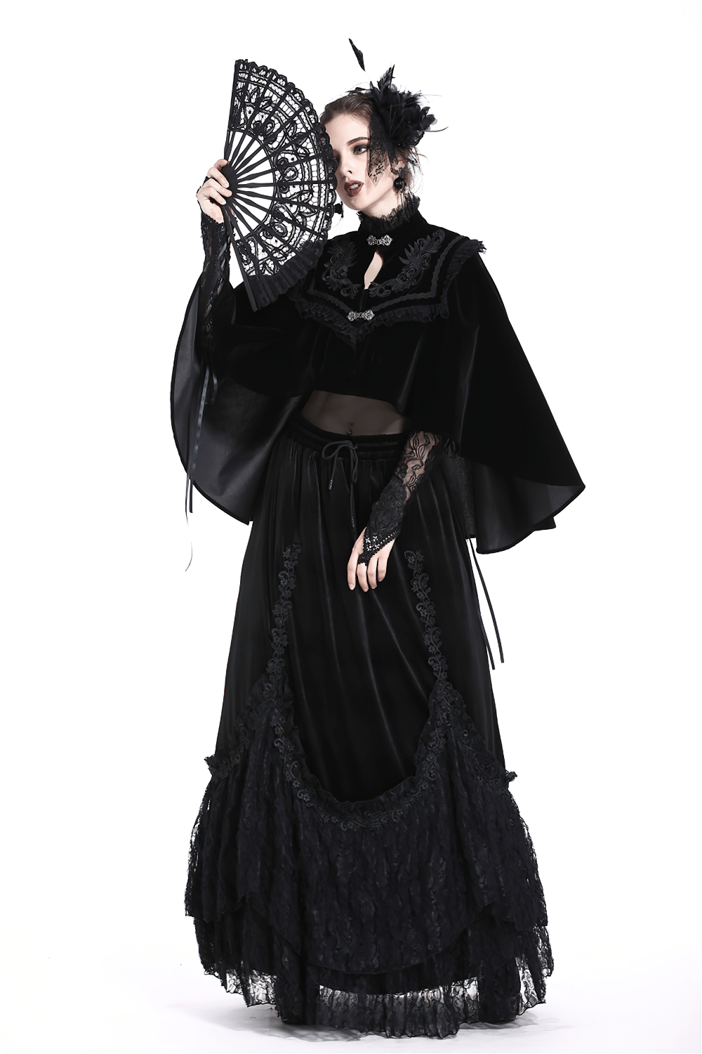 Gothic-inspired woman in elegant black lace fan and dress, perfect for evening events and sophisticated gatherings.