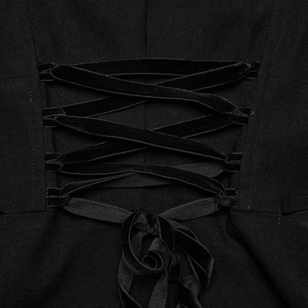 Close-up of lace-up detail on an elegant black mini dress, showcasing stylish design elements for evening wear.