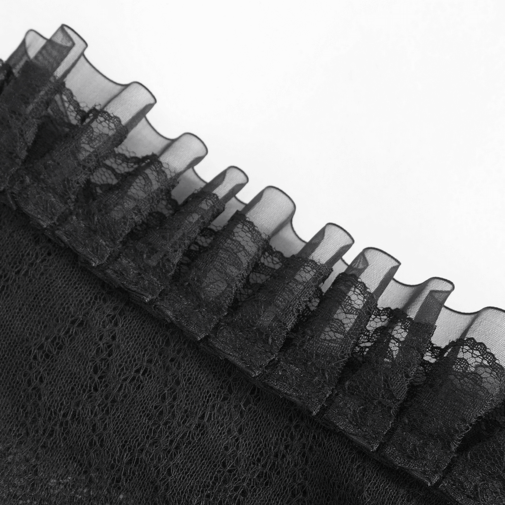 Close-up of elegant black sheer top showcasing dramatic lace ruffle details for a sophisticated look.