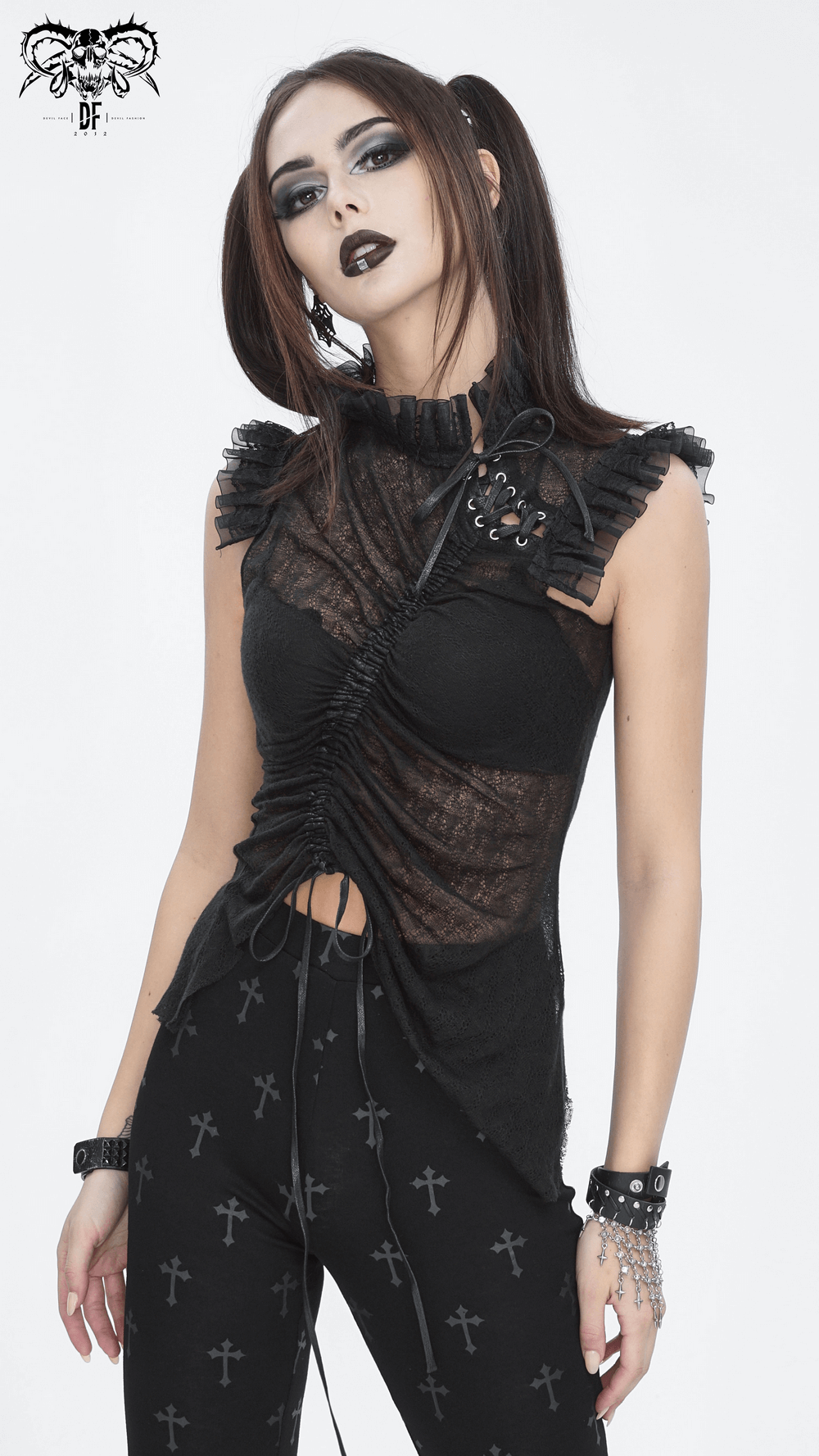 Elegant black sheer top with ruffles, perfect for a night out or special occasion, styled with edgy accessories.