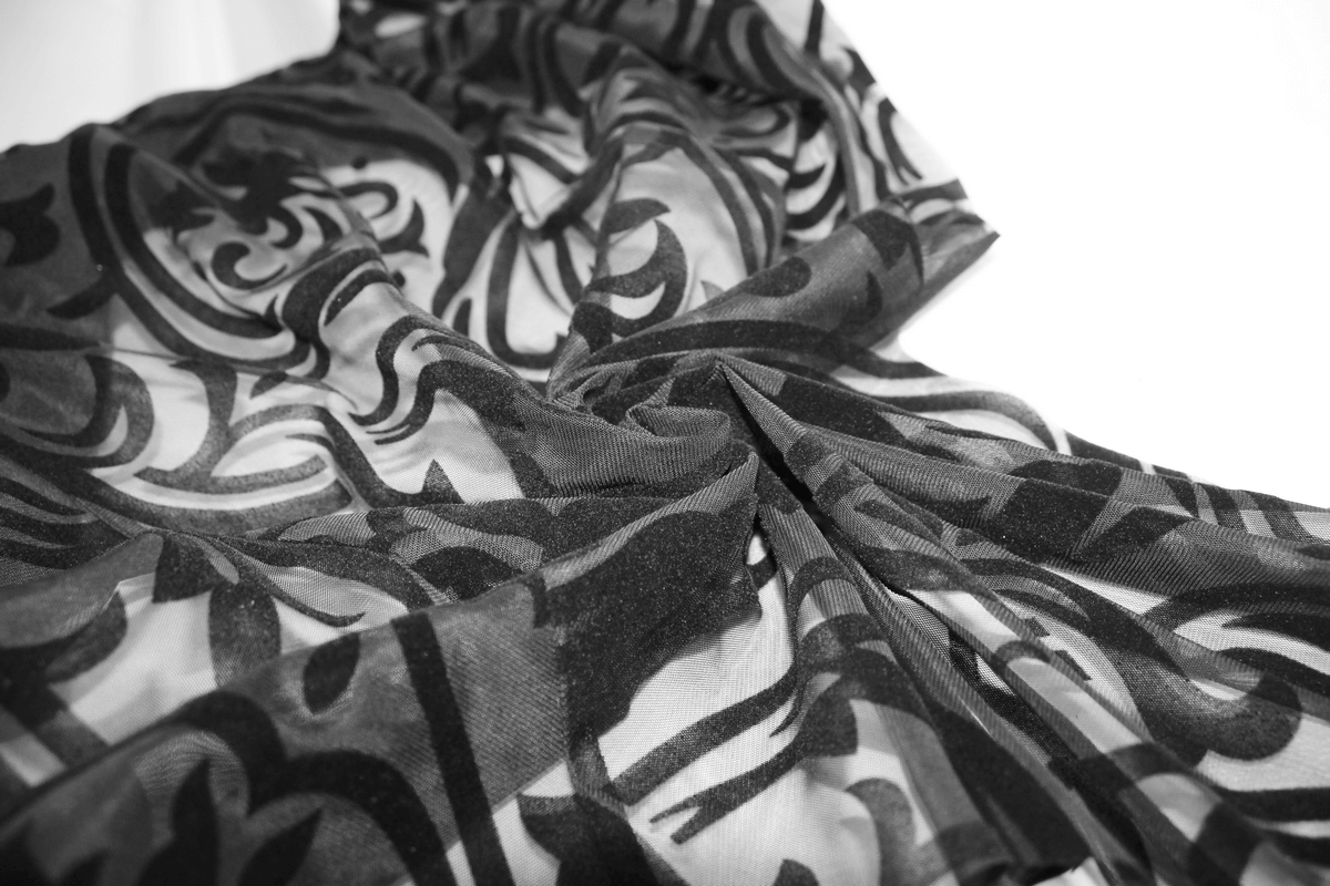 Elegant black skirt featuring gothic patterns and transparent ruffles, perfect for stylish gothic outfits.