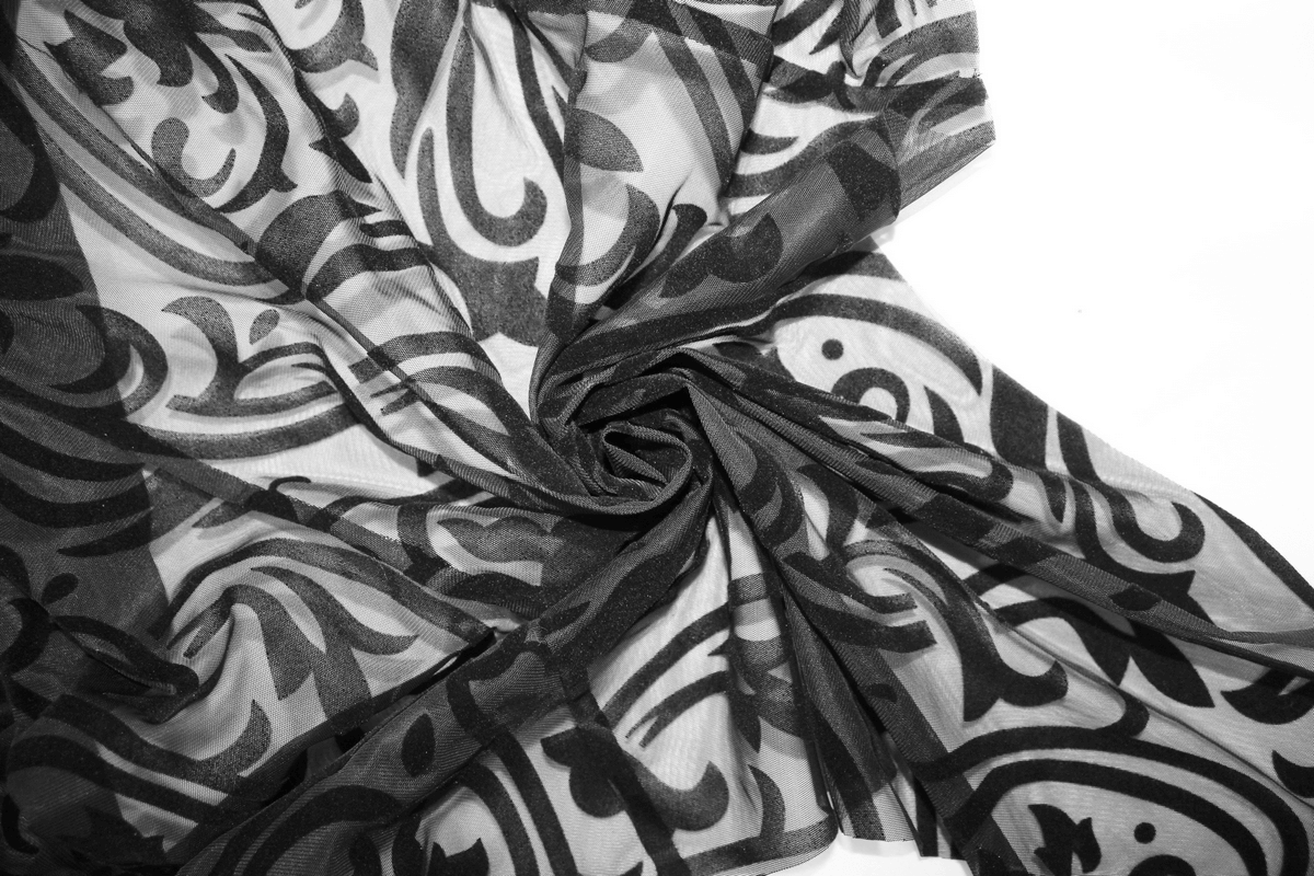 Elegant black lace fabric with intricate patterns, perfect for gothic clothing and stylish outfit creations.