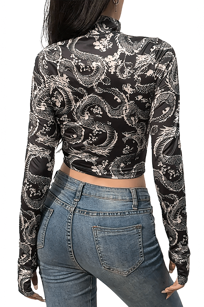Back view of a women's gray gothic crop top with floral dragon print, paired with high-waisted jeans.