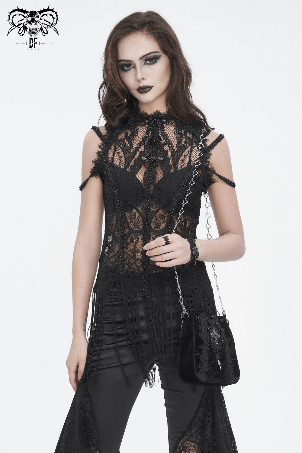 Model showcasing an Elegant Women's Gothic Floral Embroidered Shoulder Bag with edgy black outfit and dark makeup.
